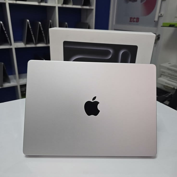 MacBook Air M1 Space Gray open on wooden desk with macOS Big Sur