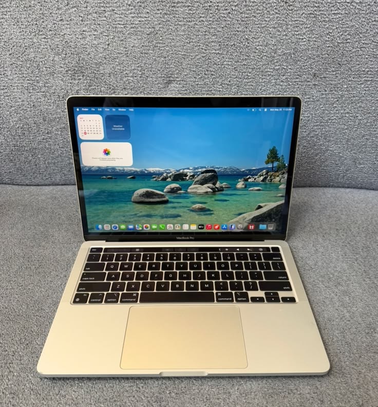 MacBook Pro M1 Silver open at angle on wooden table