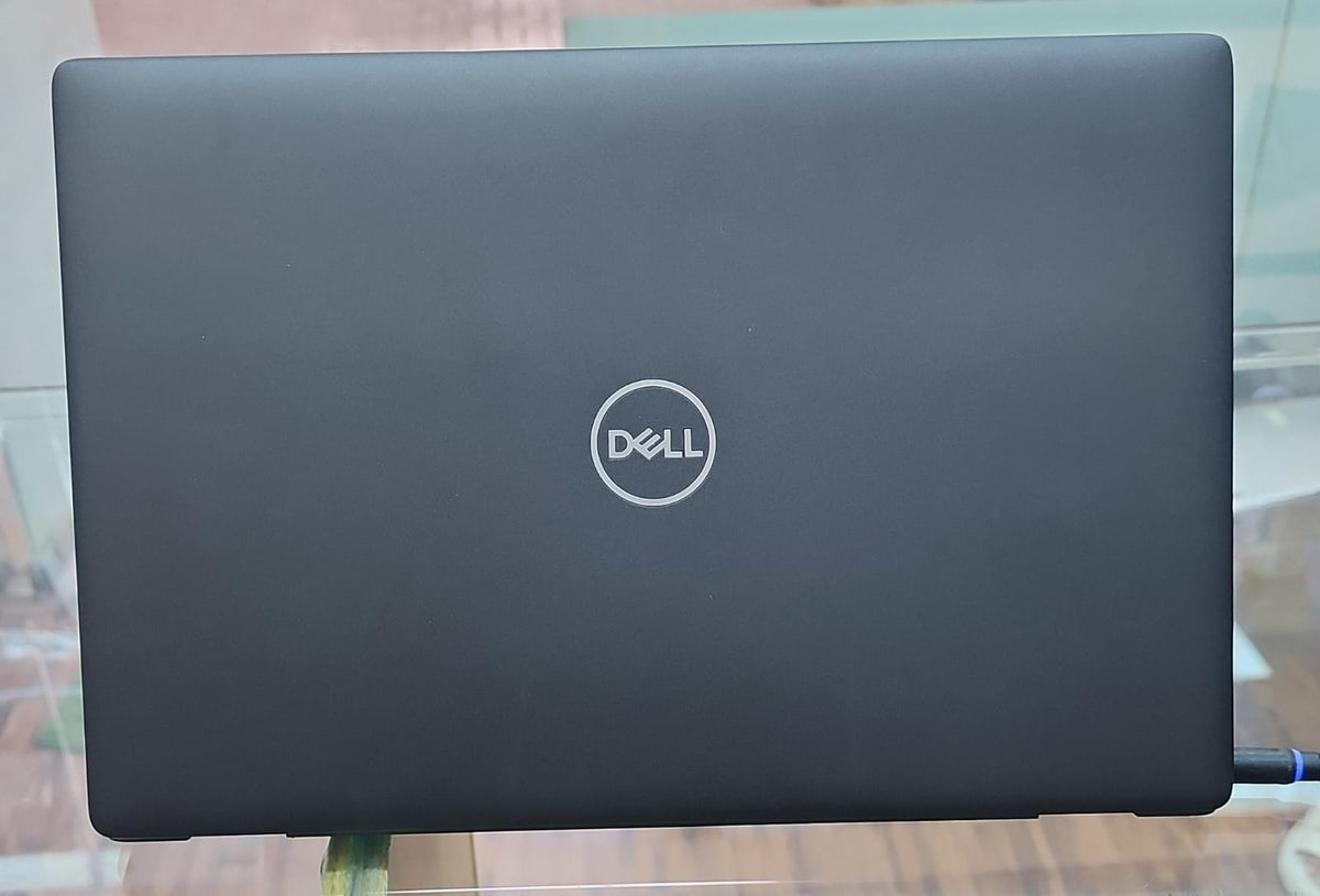 Dell Latitude closed back view showing matte black chassis with Dell logo