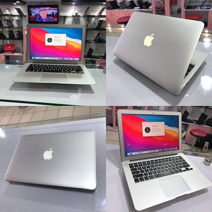 MacBook Air 13-inch open with purple macOS wallpaper