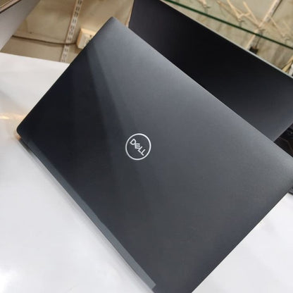 Dell Latitude closed back view showing matte black chassis with Dell logo