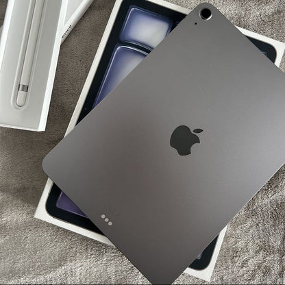 Apple iPad Air Space Gray with Apple Pencil box and original packaging on gray fabric