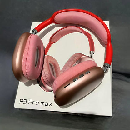 P9 Pro Max wireless headphones pink and red resting on original white box on dark background