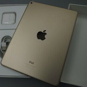 Apple iPad Air 2 Gold back view in original white box with charger and Lightning cable accessories