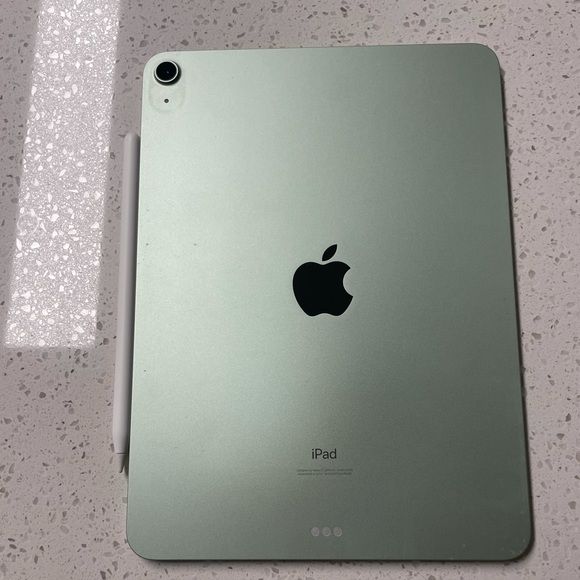 Apple iPad Air Green back view with Apple Pencil on marble surface